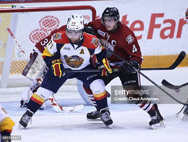 Michael Curtis of the Erie Otters battles against Matt Finn of the Guelph Storm in Game Two of the OHL Western Conference Final at the Sleeman Centre...
