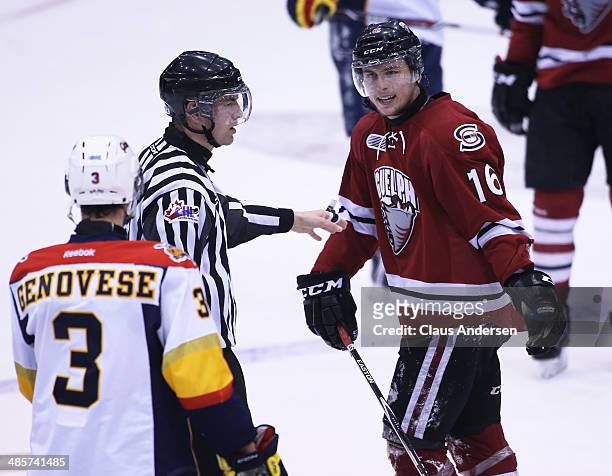 Cory Genovese of the Erie Otters argues with Kerby Rychel of the Guelph Storm in Game Two of the OHL Western Conference Final at the Sleeman Centre...