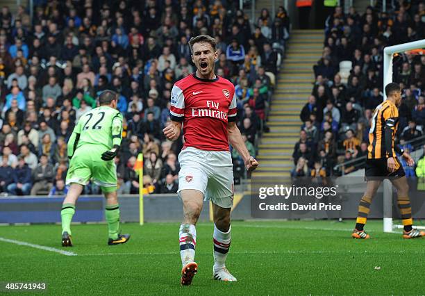 Aaron Ramsey celebrates scoring a goal for Arsenal during the match between Hull City and Arsenal in the Barclays Premier League at KC Stadium on...