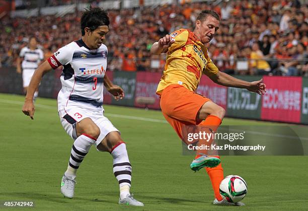 Mitchell Duke of Shimizu S-Pulse and Masato Morishige of FC Tokyo compete for the ball during the J.League match between Shimizu S-Pulse and FC Tokyo...