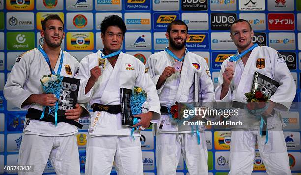 Under kg medallists L-R: Silver; Karl-Richard Frey GER, Gold; Ryunosuke Haga JPN, Bronzes; Toma Nikiforov BEL and Dimitri Peters GER during the 2015...