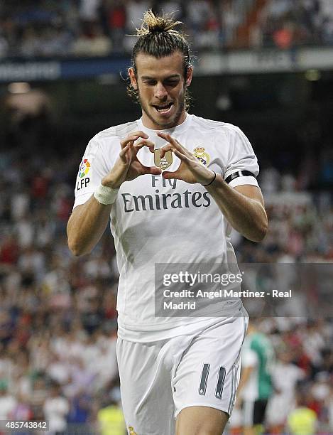 Gareth Bale of Real Madrid celebrates after scoring the opening goal during the La Liga match between Real Madrid CF and Real Betis Balompie at...