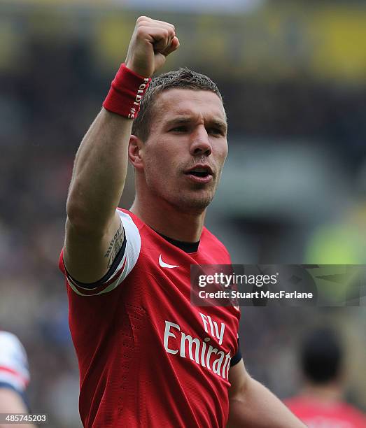 Lukas Podolski celebrates scoring the 3rd Arsenal goal during the Barclays Premier League match between Hull City and Arsenal at the KC Stadium on...