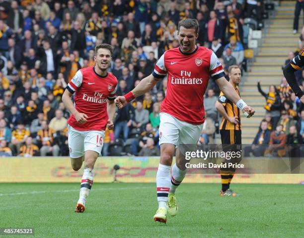 Lukas Podolski celebrates scoring Arsenal's 2nd goal with Aaron Ramsey during the match between Hull City and Arsenal in the Barclays Premier League...