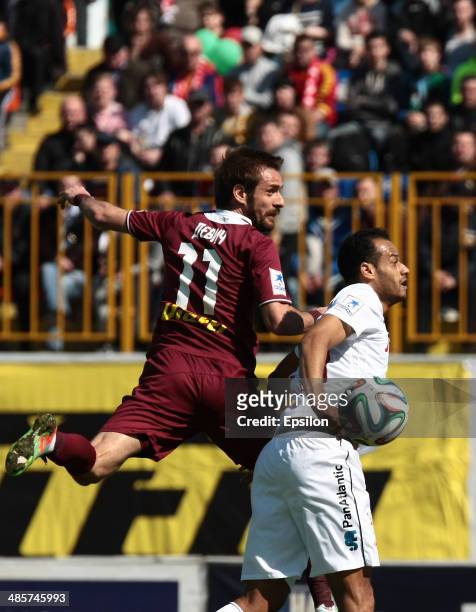 Marko Devic of FC Rubin Kazan is challenged by Joao Carlos of FC Spartak Moscow during the Russian Football League Championship match between FC...
