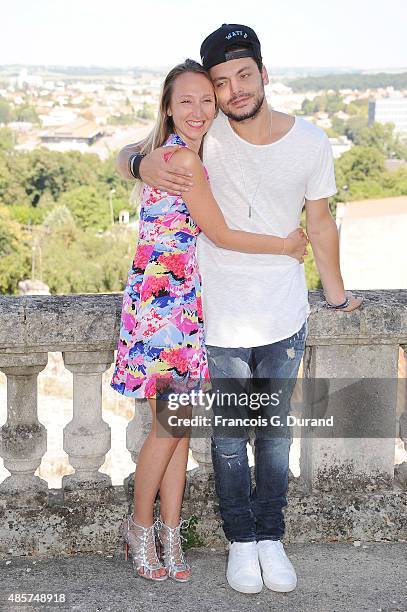 Audrey Lamy and Kev Adams attend a photocall during the 8th Angouleme French-Speaking Film Festival on August 29, 2015 in Angouleme, France.