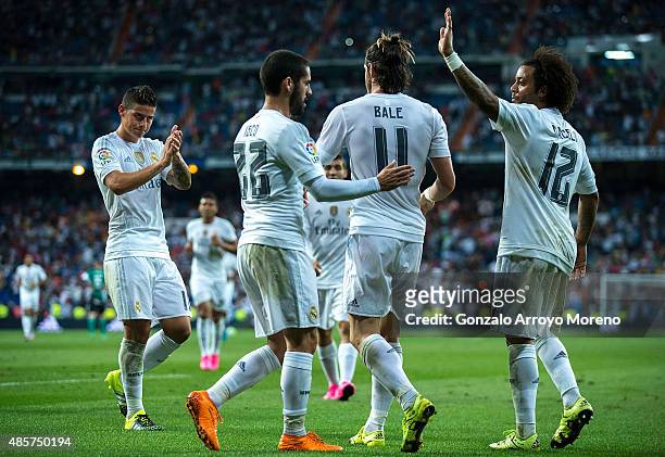 Gareth Bale of Real Madrid CF celebrates scoring their fifth goal with teammates James Rodriguez , Francisco Roman Alarcon alias Isco and Marcelo...