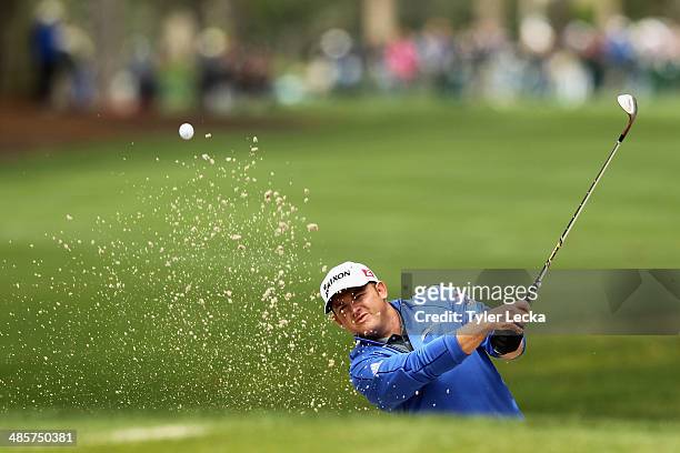 Holmes plays a shot out of the bunker on the 1st hole during the final round of the RBC Heritage at Harbour Town Golf Links on April 20, 2014 in...