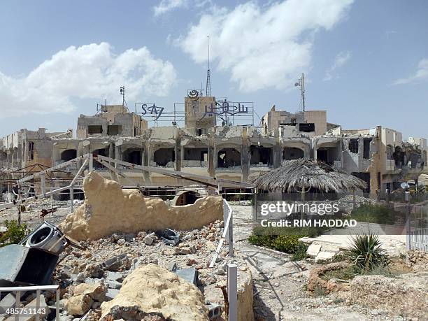 The destroyed facade of the Al-Safir hotel is pictured in the ancient Christian town of Maalula on April 20, 2014. Residents of Maalula returned to...