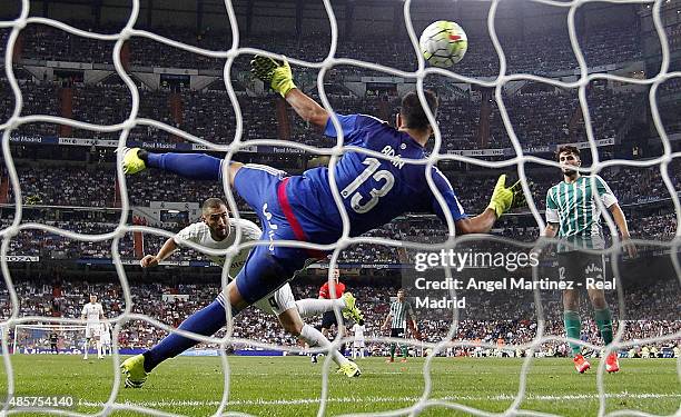 Karim Benzema of Real Madrid scores his team's third goal past Antonio Adan of Betis during the La Liga match between Real Madrid CF and Real Betis...