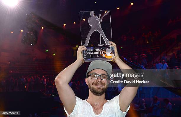 Singer Mark Forster celebrates after winning the Bundesvision Song Contest 2015 at OVB-Arena on August 29, 2015 in Bremen, Germany. On the left...