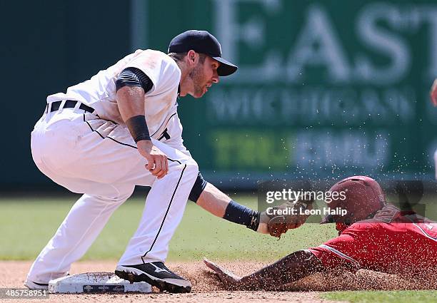 Andrew Romine of the Detroit Tigers puts the tag on Howie Kendrick of the Los Angeles Angels of Anaheim during the fourth inning of the game at...