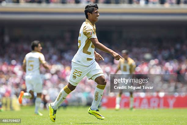 Daniel Ramirez of Pumas celebrates with his teammates after scoring the opening goal against Chivas during a match between Pumas UNAM and Chivas as...