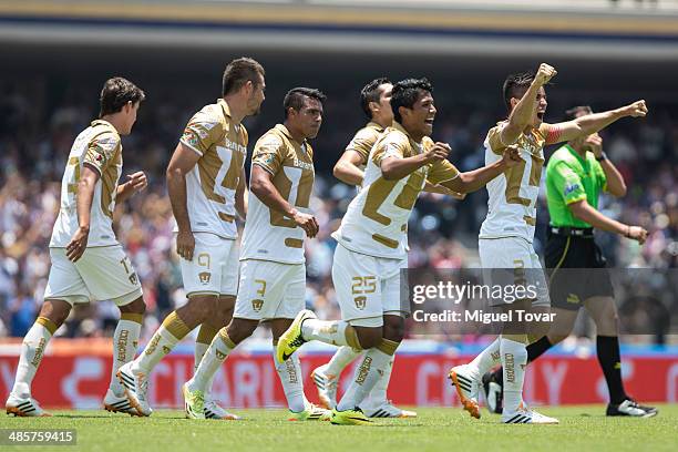 Daniel Ramirez of Pumas celebrates with his teammates after scoring the opening goal against Chivas during a match between Pumas UNAM and Chivas as...