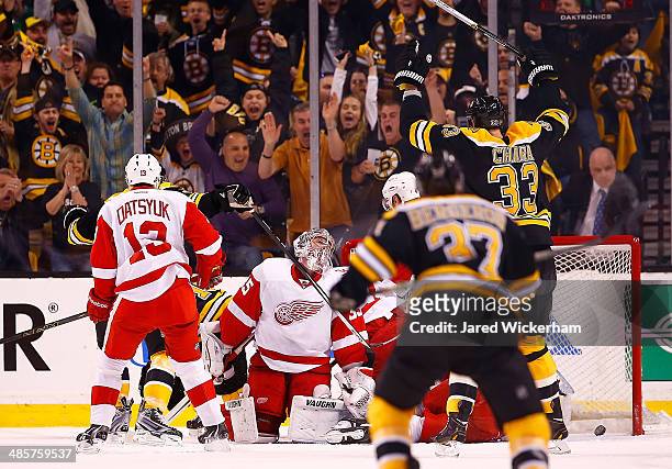 Jimmy Howard of the Detroit Red Wings reacts after being scored on in the first period by Reilly Smith of the Boston Bruins during the game at TD...