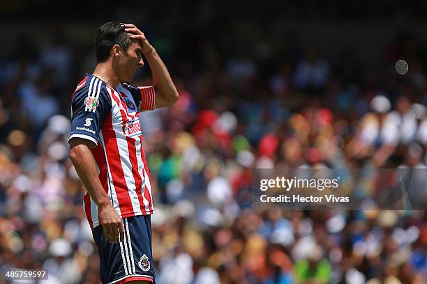 Aldo de Nigris of Chivas reacts during a match between Pumas UNAM and Chivas as part of the 16th round Clausura 2014 Liga MX at University Olympic...