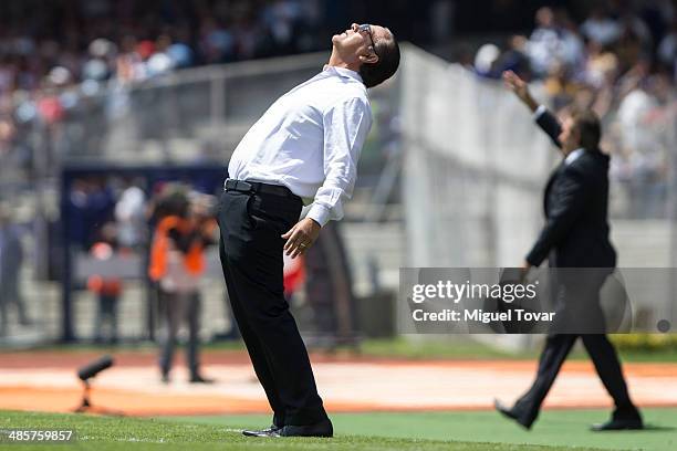 Jose Luis Trejo coach of Pumas reacts during a match between Pumas UNAM and Chivas as part of the 16th round Clausura 2014 Liga MX at University...