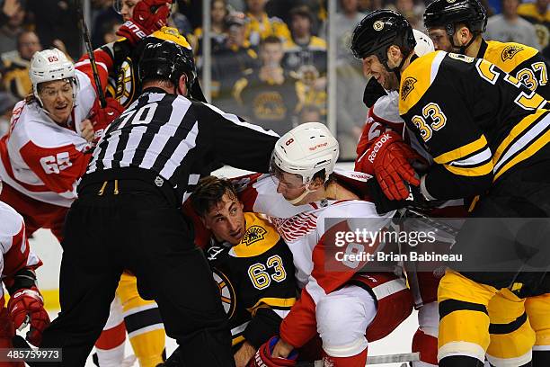 Brad Marchand of the Boston Bruins gets pinned down by Justin Abdelkader of the Detroit Red Wings in Game Two of the First Round of the 2014 Stanley...