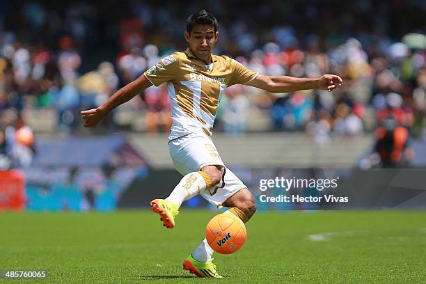 Luis Fuentes of Pumas drives the ball during a match between Pumas UNAM and Chivas as part of the 16th round Clausura 2014 Liga MX at University...