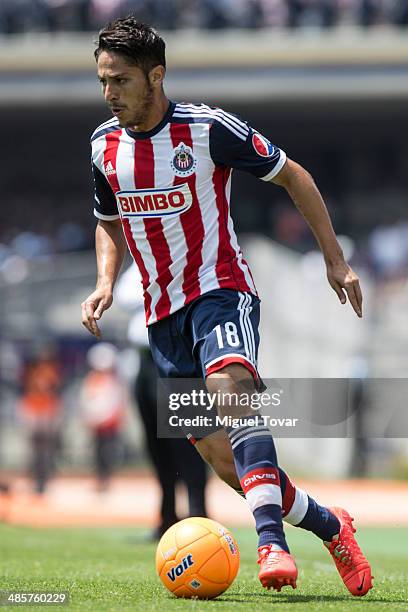 Edgar Solis of Chivas drives the ball during a match between Pumas UNAM and Chivas as part of the 16th round Clausura 2014 Liga MX at University...