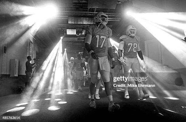 Ryan Tannehill of the Miami Dolphins takes the field during a preseason game against the Atlanta Falcons at Sun Life Stadium on August 29, 2015 in...