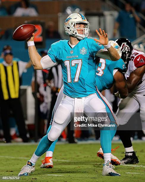 Ryan Tannehill of the Miami Dolphins passes during a preseason game against the Atlanta Falcons at Sun Life Stadium on August 29, 2015 in Miami...