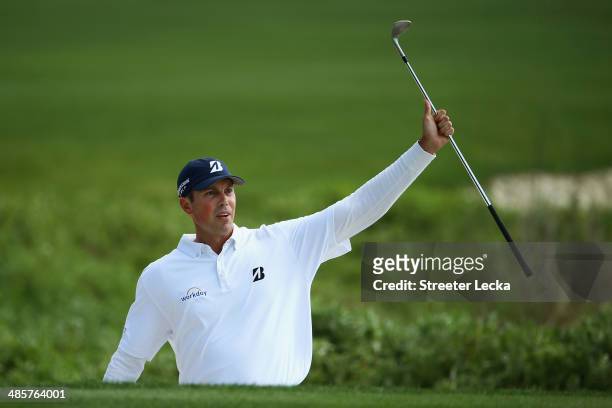 Matt Kuchar watches his shot on the 18th green during the final round of the RBC Heritage at Harbour Town Golf Links on April 20, 2014 in Hilton Head...