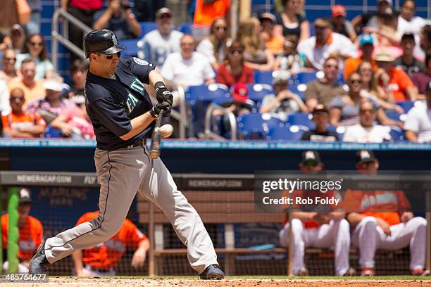 Willie Bloomquist of the Seattle Mariners hits the ball during the third inning of the game against the Miami Marlins at Marlins Park on April 20,...