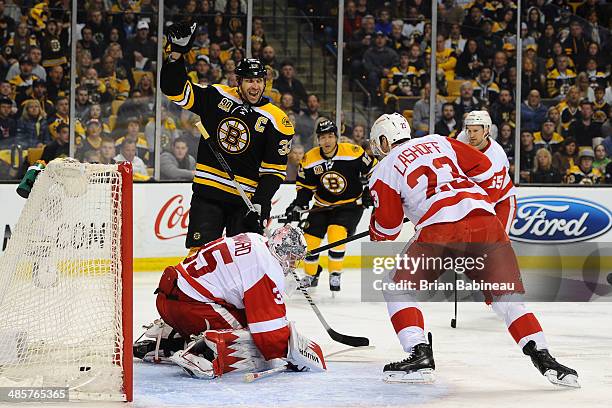 Zdeno Chara of the Boston Bruins celebrates a goal against the Detroit Red Wings in Game Two of the First Round of the 2014 Stanley Cup Playoffs at...