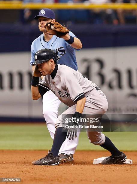 Second baseman Logan Forsythe of the Tampa Bay Rays catches Ichiro Suzuki of the New York Yankees attempting to steal second base during the 11th...