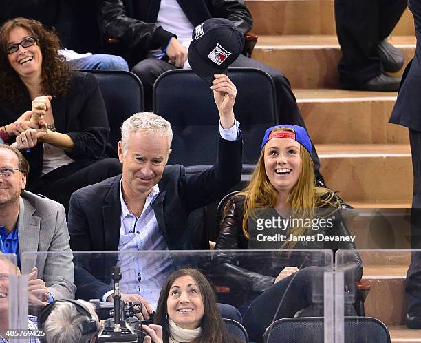 John McEnroe and Anna McEnroe attend the Philadelphia Flyers vs New York Rangers playoff game at Madison Square Garden on April 20, 2014 in New York...