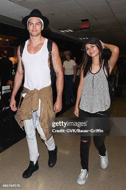 Victoria Justice and Pierson Fode are seen at LAX. On August 29, 2015 in Los Angeles, California.