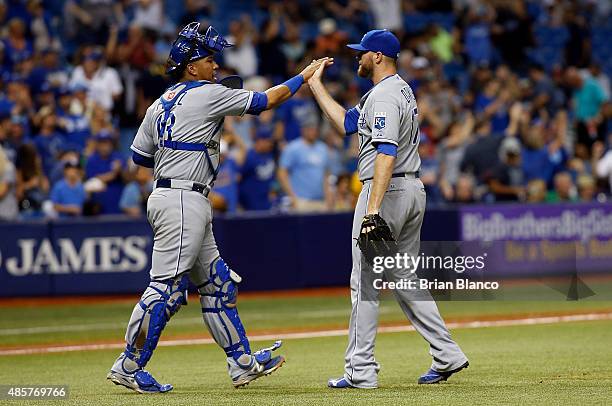 Pitcher Wade Davis of the Kansas City Royals celebrates with catcher Salvador Perez following the Royals' 6-3 win over the Tampa Bay Rays during a...