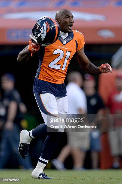 Aqib Talib of the Denver Broncos runs off the field after picking up Reggie Bush of the San Francisco 49ers and dropping him for a third-down stop...