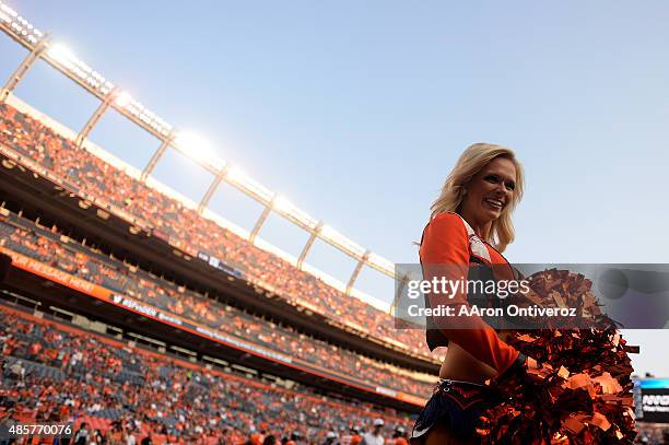 Denver Broncos cheerleader awaits the action against the San Francisco 49ers before the first half of action at Sports Authority Field at Mile High...