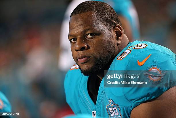 Ndamukong Suh of the Miami Dolphins looks on during a preseason game against the Atlanta Falcons at Sun Life Stadium on August 29, 2015 in Miami...