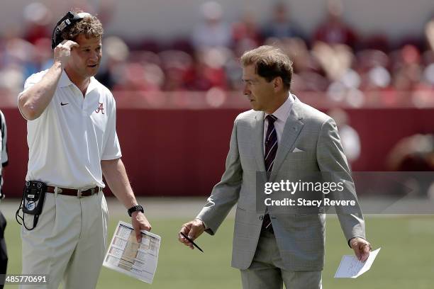 Head coach Nick Saban of the Alabama Crimson Tide speaks with offensive coordinator Lane Kiffin during the Alabama A-Day spring game at Bryant-Denny...