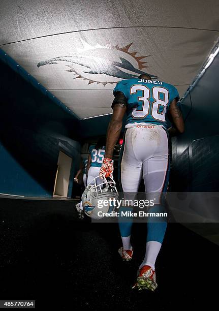 Don Jones of the Miami Dolphins walks off the field during a preseason game against the Atlanta Falcons at Sun Life Stadium on August 29, 2015 in...