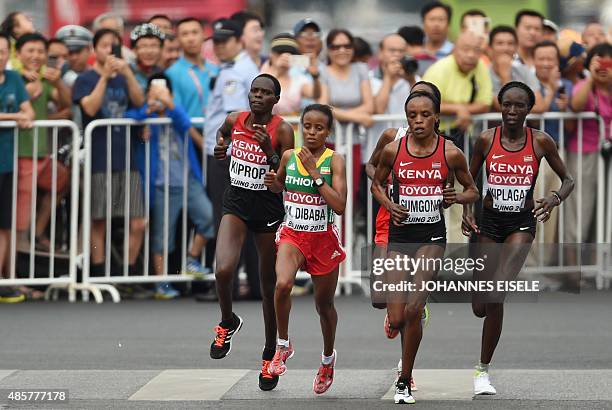 Kenya's Helah Kiprop, Ethiopia's Mare Dibaba, Kenya's Jemima Jelagat Sumgong and Kenya's Edna Ngeringwony Kiplagat compete in the final of the...