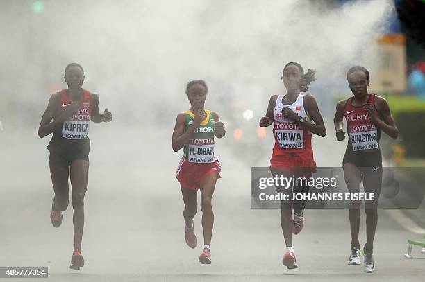 Kenya's Helah Kiprop, Ethiopia's Mare Dibaba, Bahrain's Eunice Jepkirui Kirwa and Kenya's Jemima Jelagat Sumgong compete in the final of the women's...