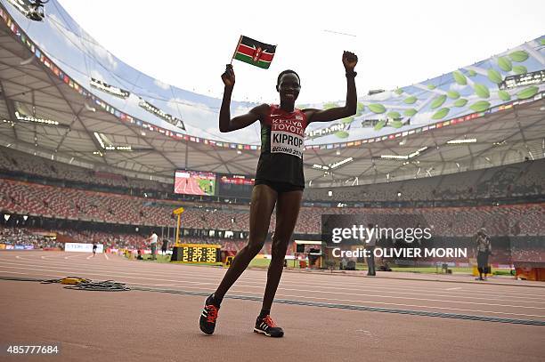 Kenya's Helah Kiprop celebrates after coming in second place in the final of the women's marathon athletics event at the 2015 IAAF World...