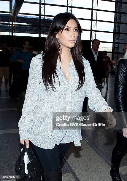 Kim Kardashian is seen at Los Angeles International Airport on February 15, 2013 in Los Angeles, California.