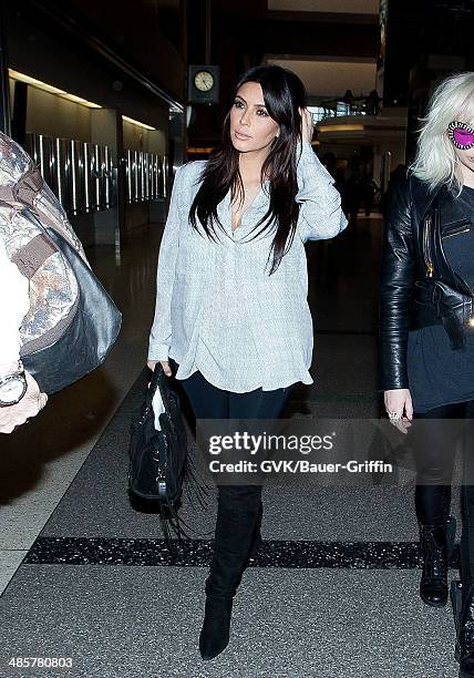 Kim Kardashian is seen at Los Angeles International Airport on February 15, 2013 in Los Angeles, California.