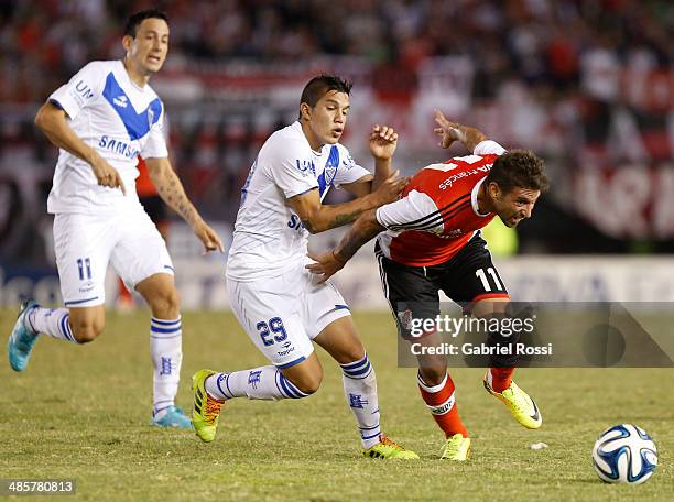 Osmar Ferreyra of River Plate fights for the ball with Alan Aguirre of Velez Sarsfield during a match between River Plate and Velez Sarsfield as part...