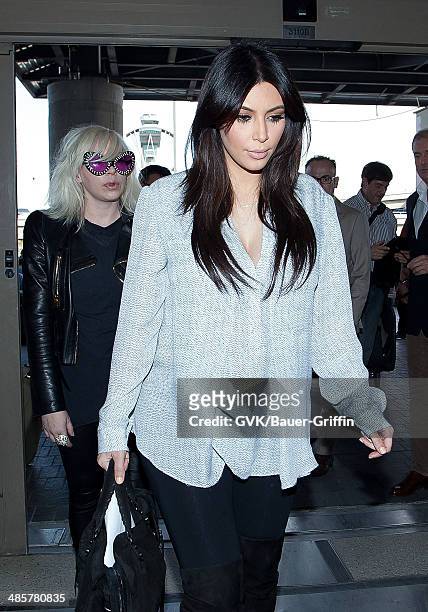 Kim Kardashian is seen at Los Angeles International Airport on February 15, 2013 in Los Angeles, California.