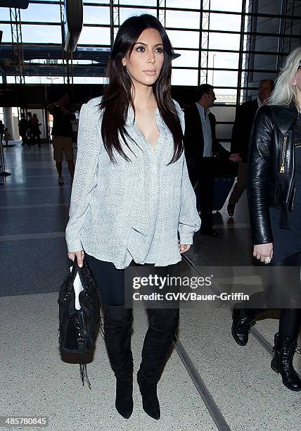 Kim Kardashian is seen at Los Angeles International Airport on February 15, 2013 in Los Angeles, California.