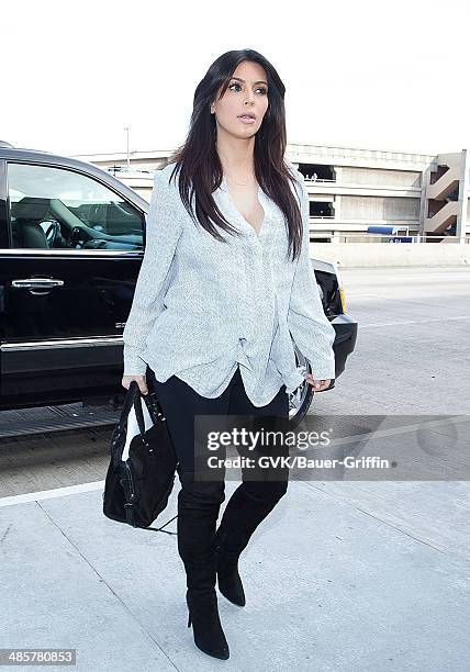 Kim Kardashian is seen at Los Angeles International Airport on February 15, 2013 in Los Angeles, California.