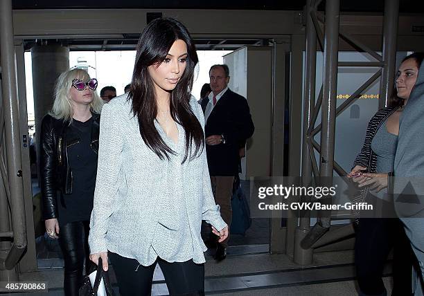 Kim Kardashian is seen at Los Angeles International Airport on February 15, 2013 in Los Angeles, California.