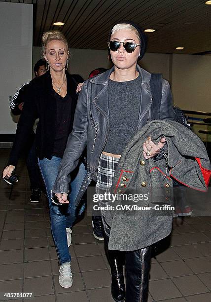 Miley Cyrus and her mother Tish Cyrus are seen at Los Angeles International Airport on February 15, 2013 in Los Angeles, California.