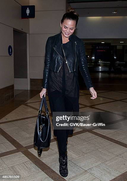 Christine Teigen is seen at Los Angeles International Airport on February 15, 2013 in Los Angeles, California.